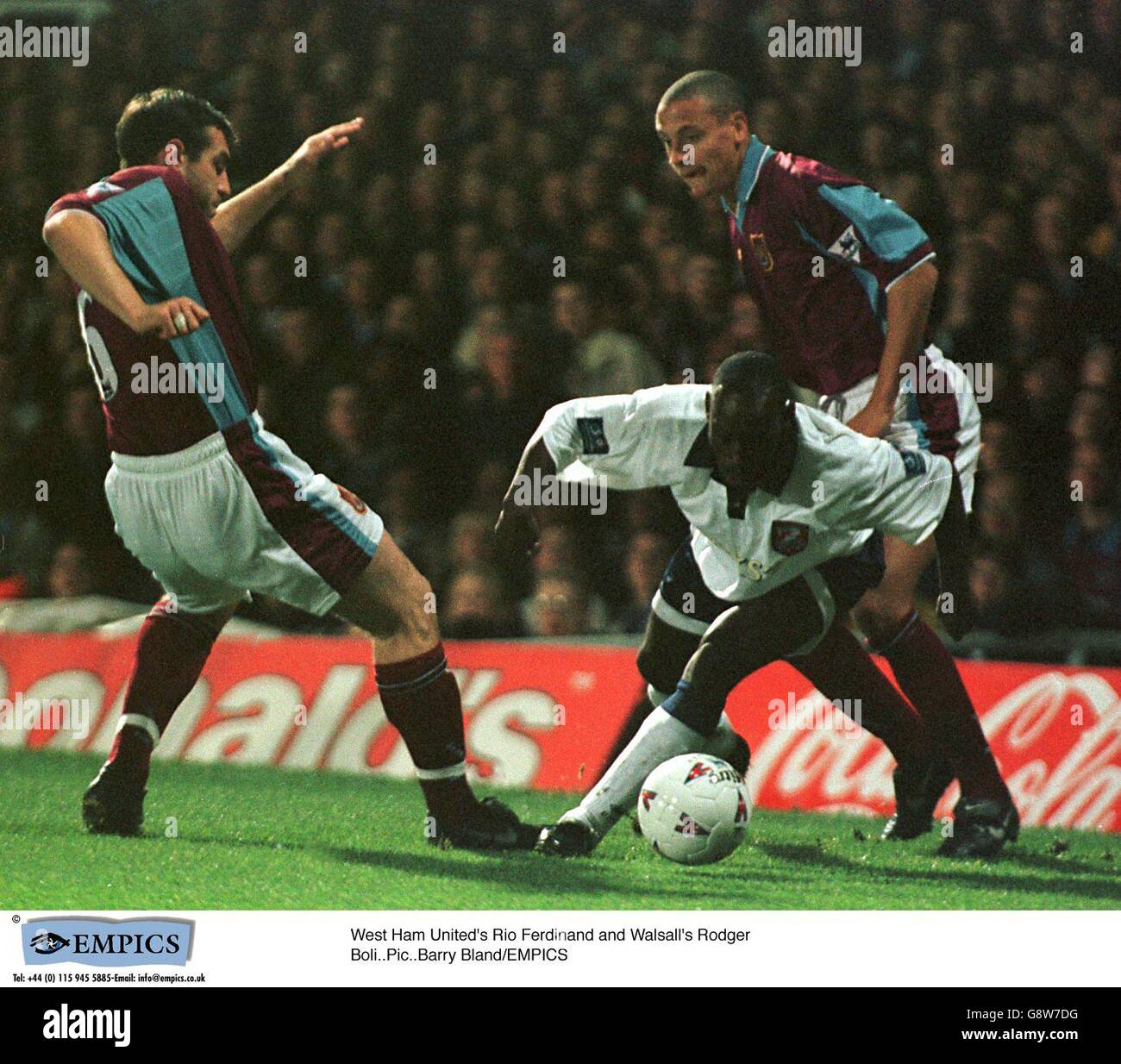 Walsall's Roger Boli (centre) dodges between West Ham United's David ...
