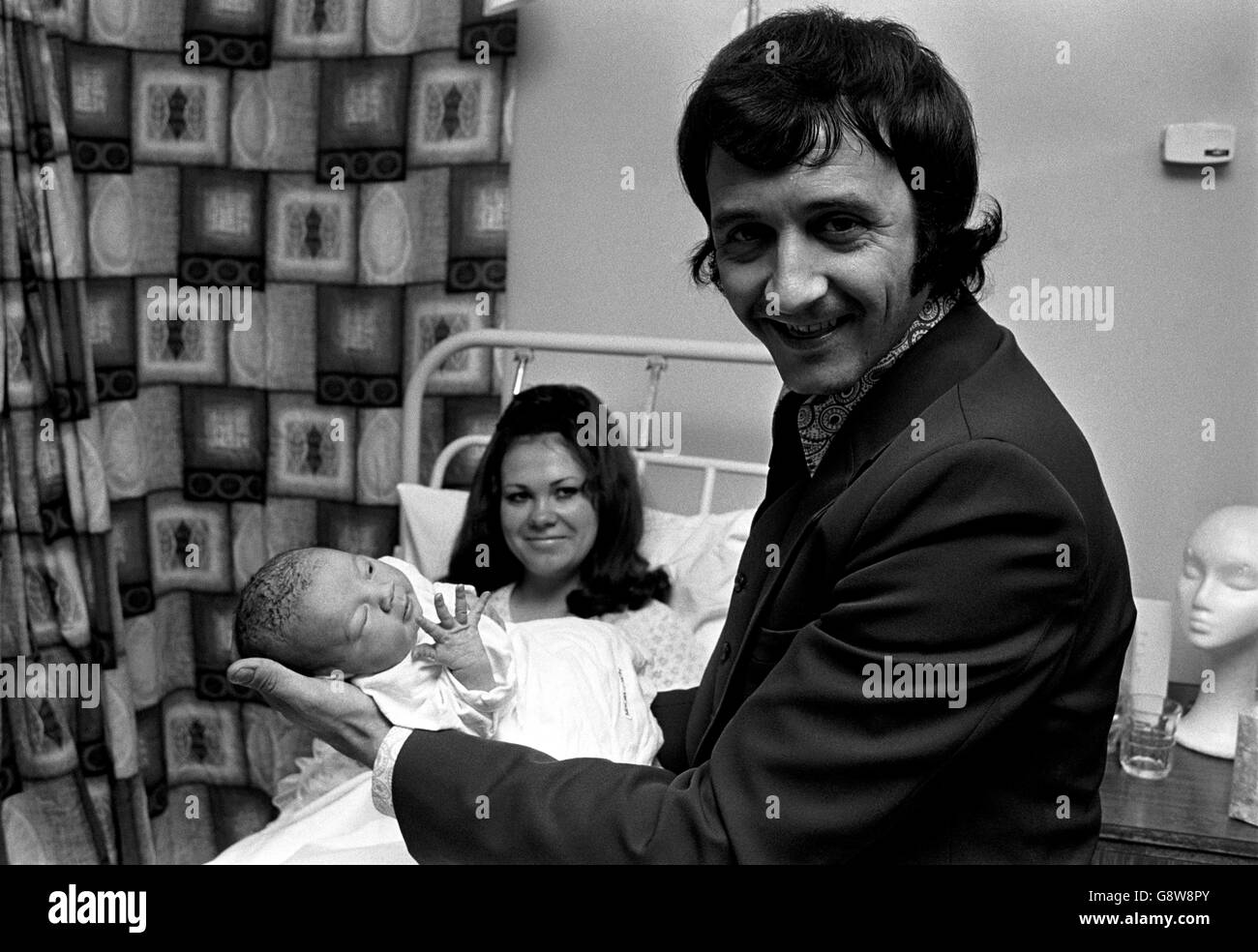 Pop chart-topper Tony Christie and his wife Sue, with their baby daughter, weighing 6lb 15oz at Neathedge Hospital. They are calling the baby Antonia Maria. Stock Photo