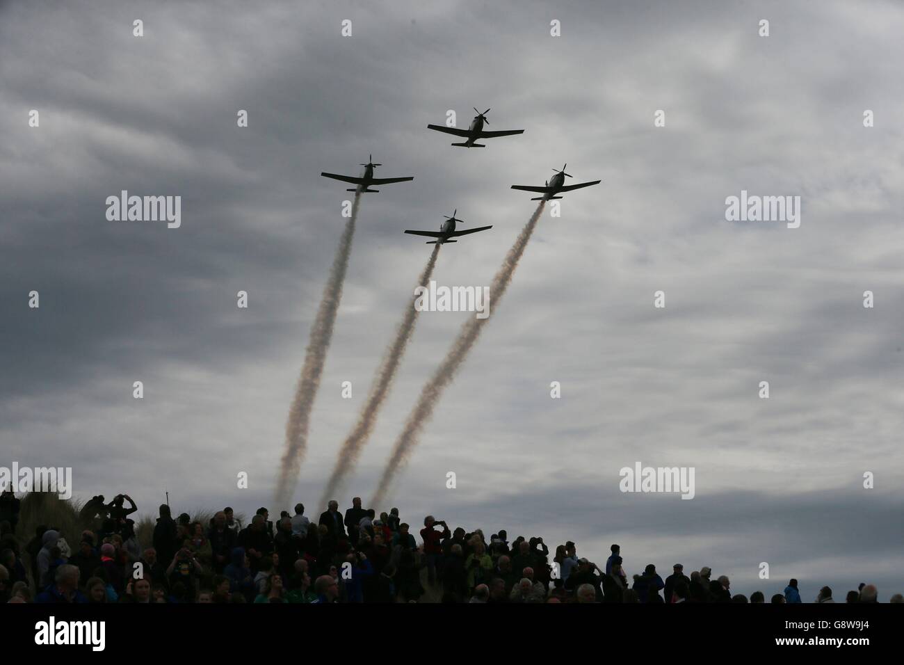 The Air Corp performs a fly past during a ceremony at Banna Strand in Co Kerry to mark the centenary of the capture and execution of Sir Roger Casement. Stock Photo