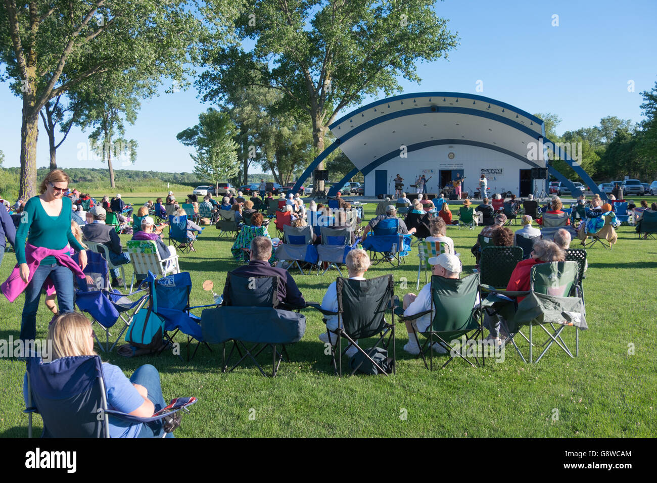 Outdoor community concert at the band shell in Montague, Michigan, USA. Stock Photo