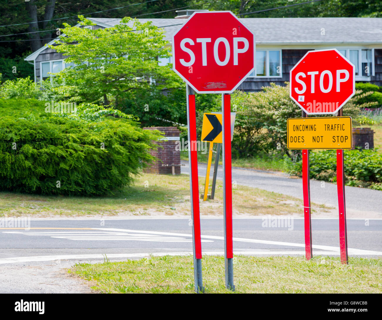 two stop signs at an intersection in Sag Harbor, NY Stock Photo