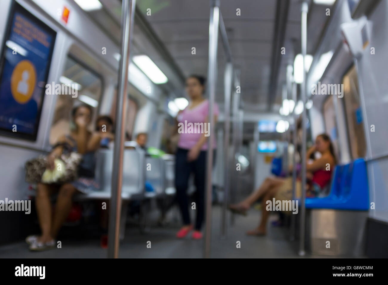 Abstract defocus scene of passengers riding a commuter train in Rio de Janeiro, Brazil Stock Photo