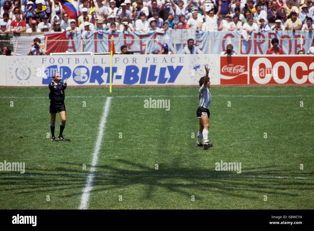 Diego Maradona of Argentina (right) celebrates victory as referee Morera Ulloa (left) blows the final whistle Stock Photo