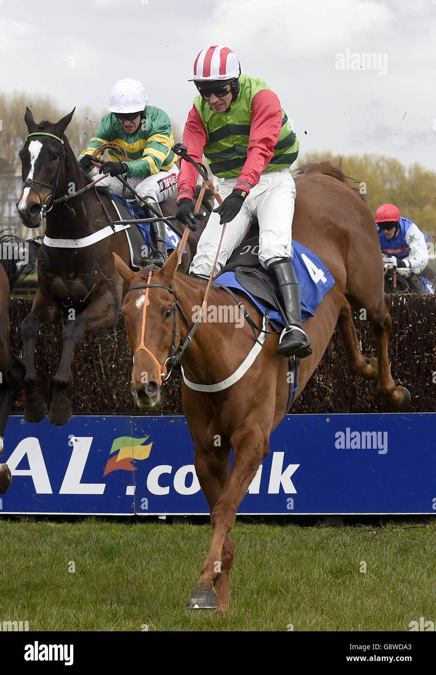 Definitely Red ridden by Danny Cook on his way to winning the Hillhouse Quarry Handicap Steeple Chase during Ladies Day of the Coral Scottish Grand National Festival at Ayr Racecourse. Stock Photo
