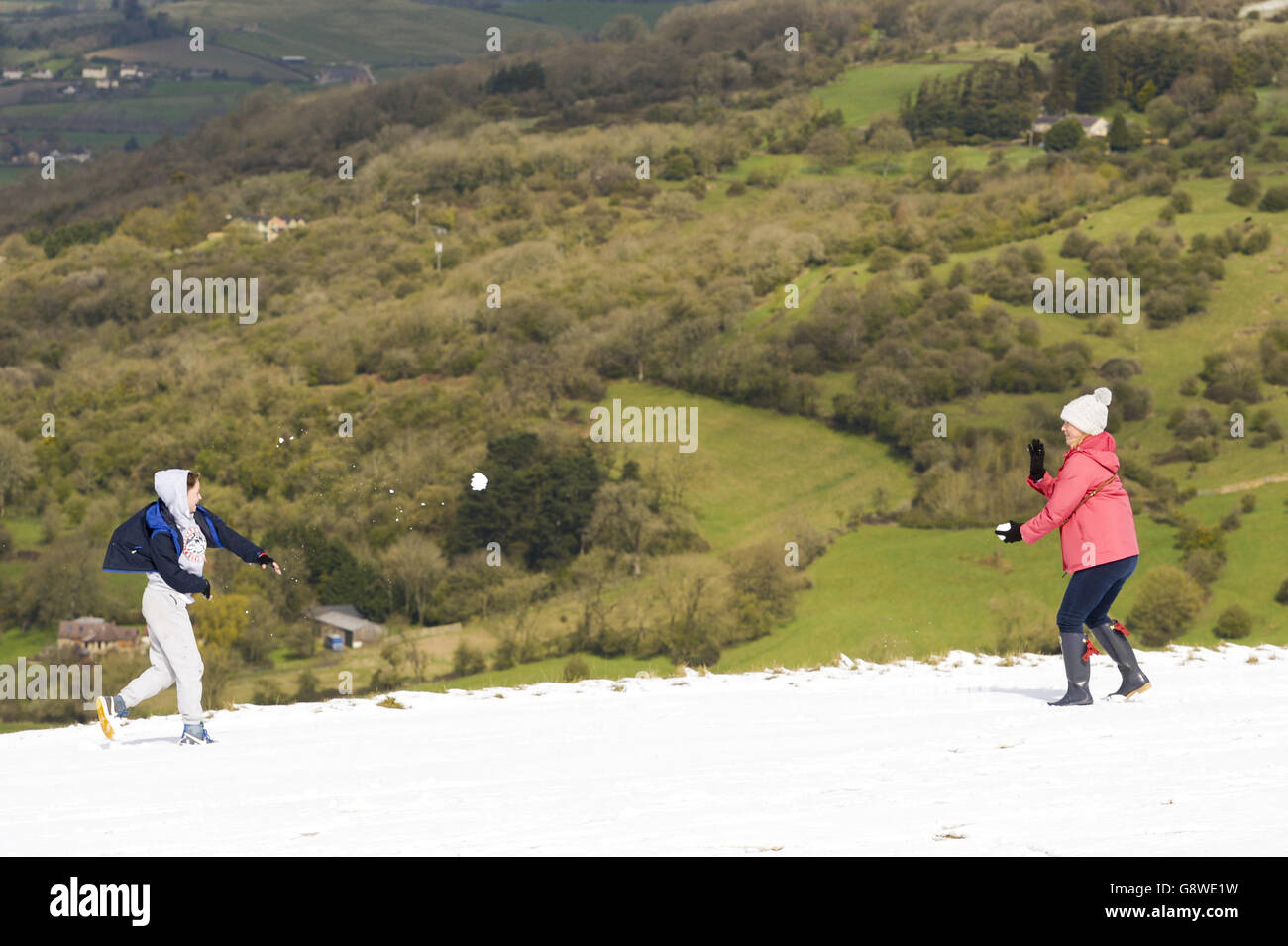 People playing in snow on Cleeve Hill, Celtenham, as a cold snap