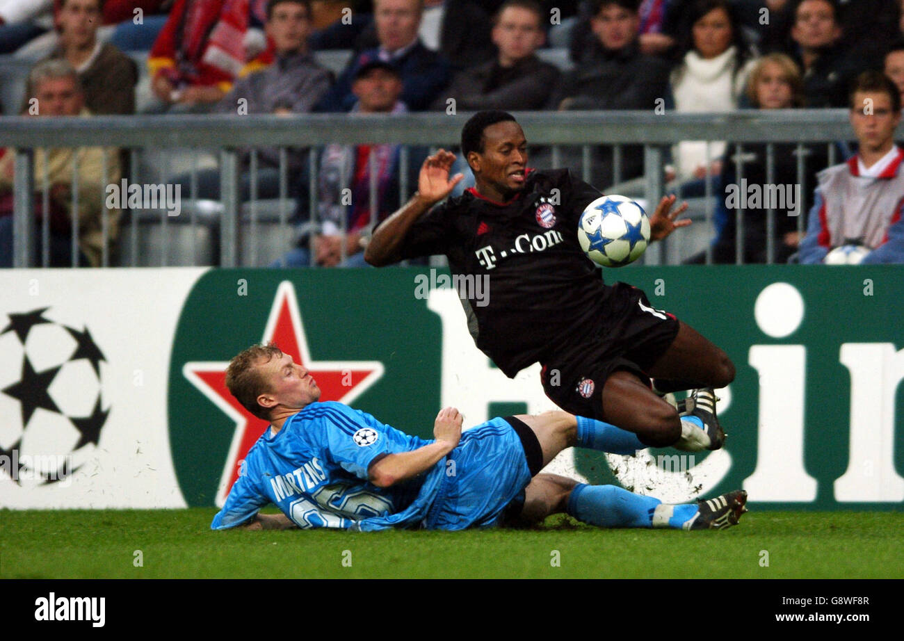 Bayern Munich's Ze Roberto is tackled by Club Brugge's Birger Maertens Stock Photo