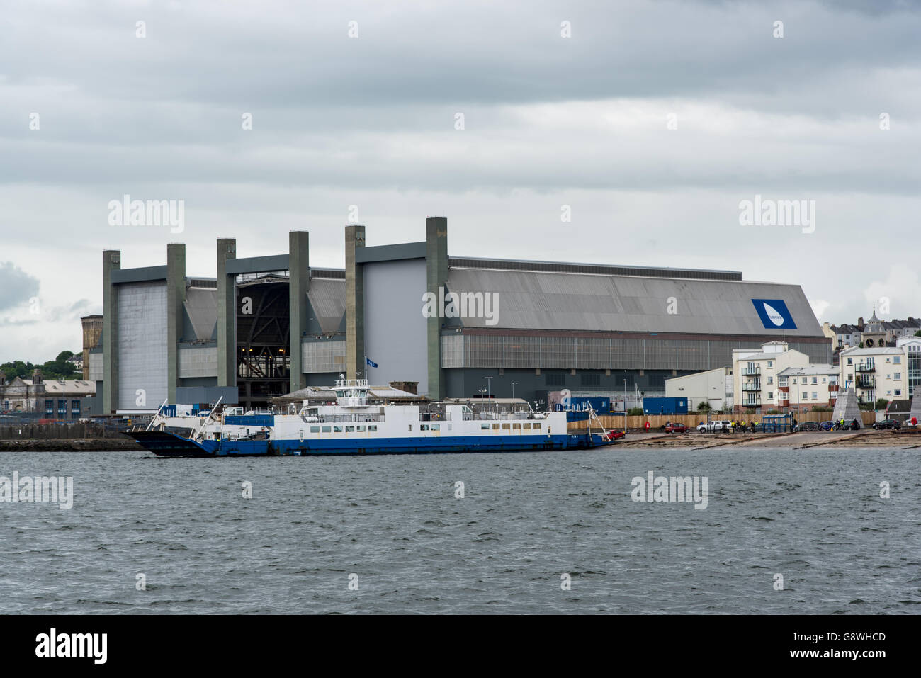 The Frigate Refit Complex at HMNB Devonport, Plymouth, Devon with Torpoint Ferry Plym II. Stock Photo