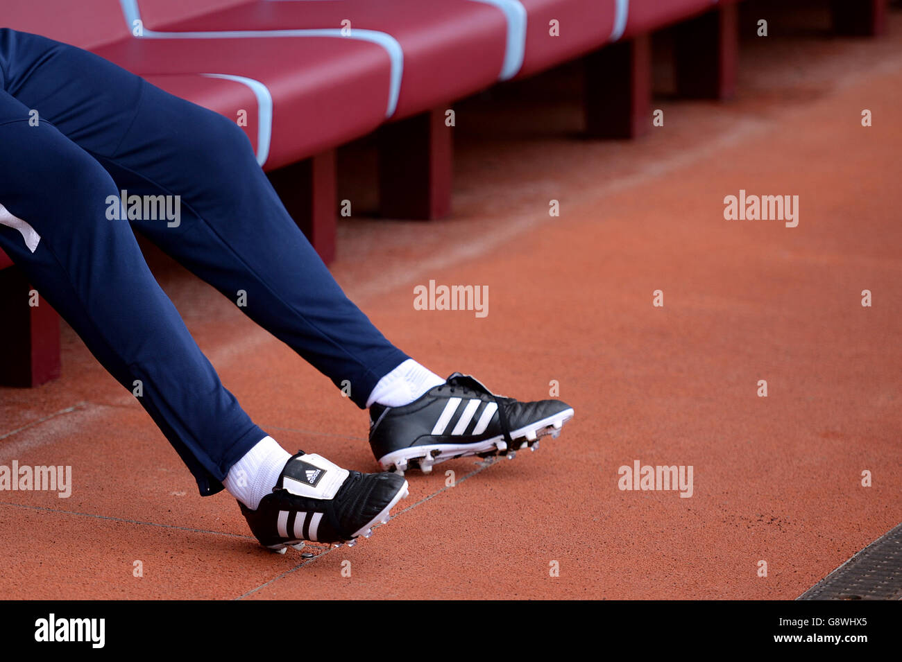 Burnley v Leeds United - Sky Bet Championship - Turf Moor. Detail of a  player wearing tracksuit bottoms and Adidas football boots sitting in the  Burnley dugout before the game Stock Photo - Alamy