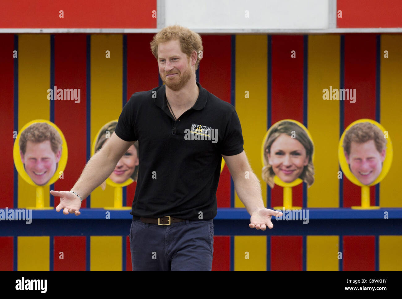 Prince Harry takes part in filming a segment where a photo of him is