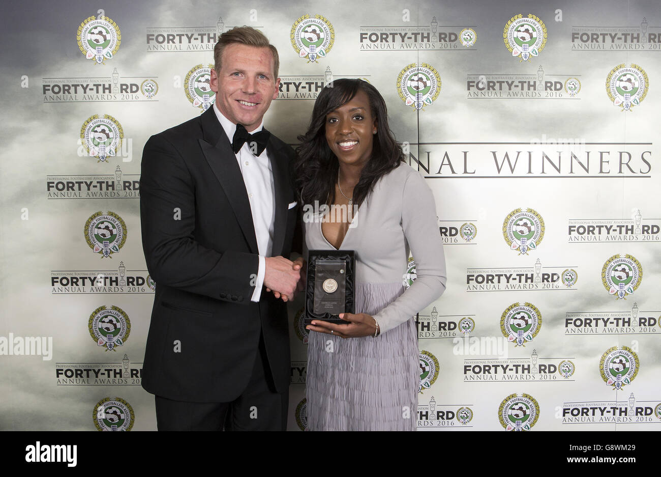 Chairman of the Professional Footballers' Association Ritchie Humphreys (left) presents Arsenal's Danielle Carter with the PFA Womens Team of the Year Award 2016 during the PFA Awards at the Grosvenor House Hotel, London. Stock Photo
