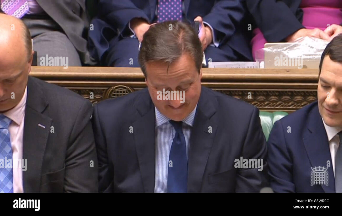 Prime Minister David Cameron listens to Labour leader Jeremy Corbyn respond to his statement to the House of Commons over his personal finances following the news that it emerged he had profited from an offshore fund. Stock Photo