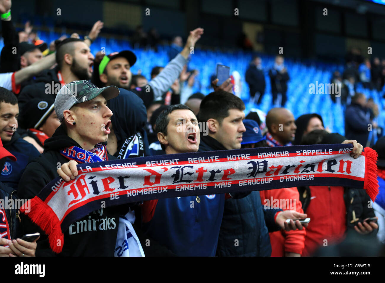 Paris SaintGermain fans cheer on their side in the stands during the