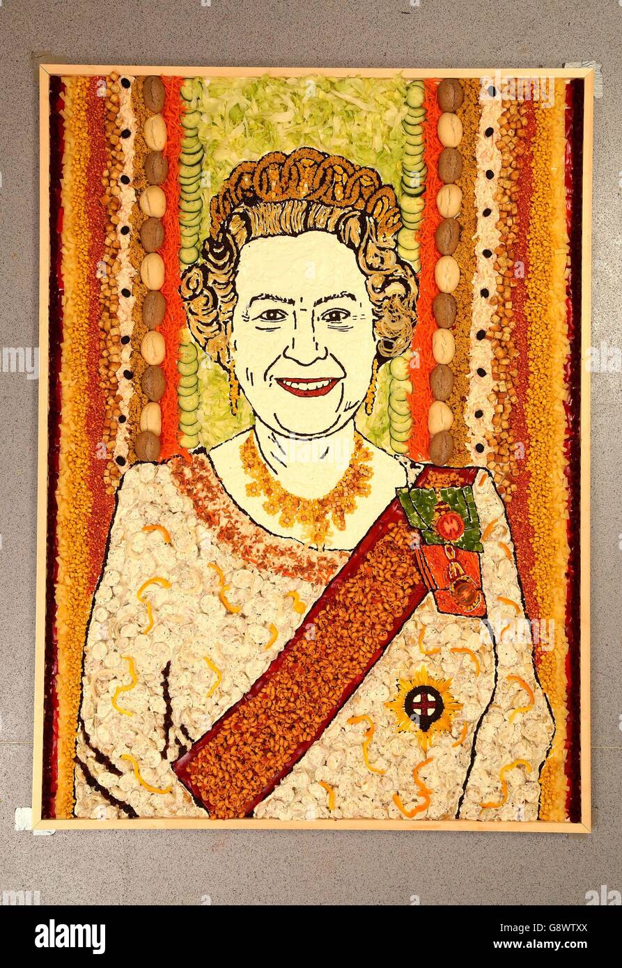 A portrait of Queen Elizabeth II which has been created by food artist Prudence Staite using ingredients from Harvester's salad bar to celebrate the monarch's up-coming 90th birthday. Stock Photo