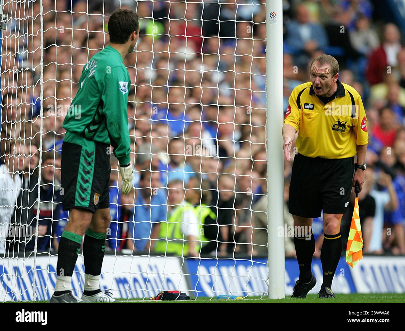 Aston Villa goalkeeper Thomas Sorensen is told to stay on his line by the assistant referee prior to Chelsea's Frank Lampard taking the penalty Stock Photo