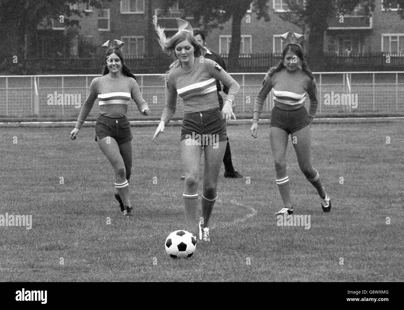 Action from a football match for a team of Playboy Bunnies against 'Apes' from the film Battle for the Planet of the Apes. The game was in aid of the World Wildlife Fund. Stock Photo