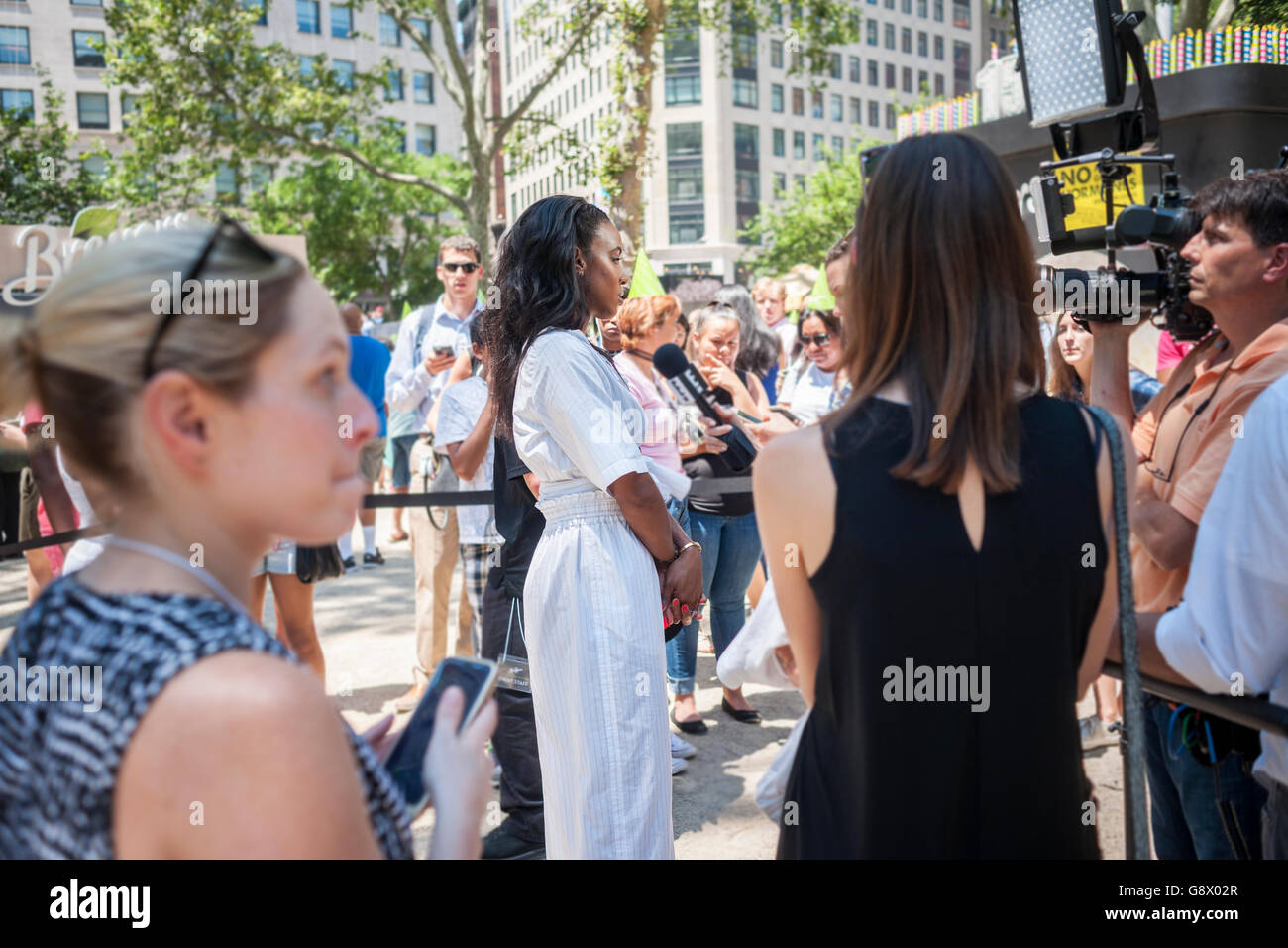 Actress/singer Kelly Rowland is interviewed in Madison Square Park in New York during the Breyers ice cream event on Wednesday, June 22, 2016. Breyers is giving away the summer treat as a celebration of the company's 150th anniversary. Besides the dessert visitors had the opportunity to meet various celebrities that Breyers had brought in. Breyers is a brand of the giant conglomerate Unilever. (© Richard B. Levine) Stock Photo