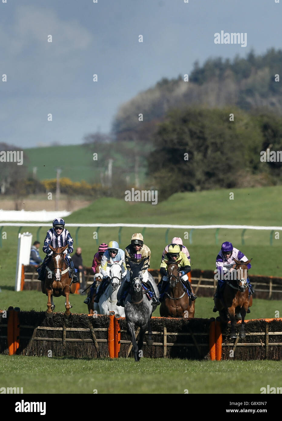 Runners and riders during the Ortus Homes Racing Excellence Hands and Heels' Finale Handicap Hurdle during Scottish Grand National Day at the Coral Scottish Grand National Festival at Ayr Racecourse. Stock Photo