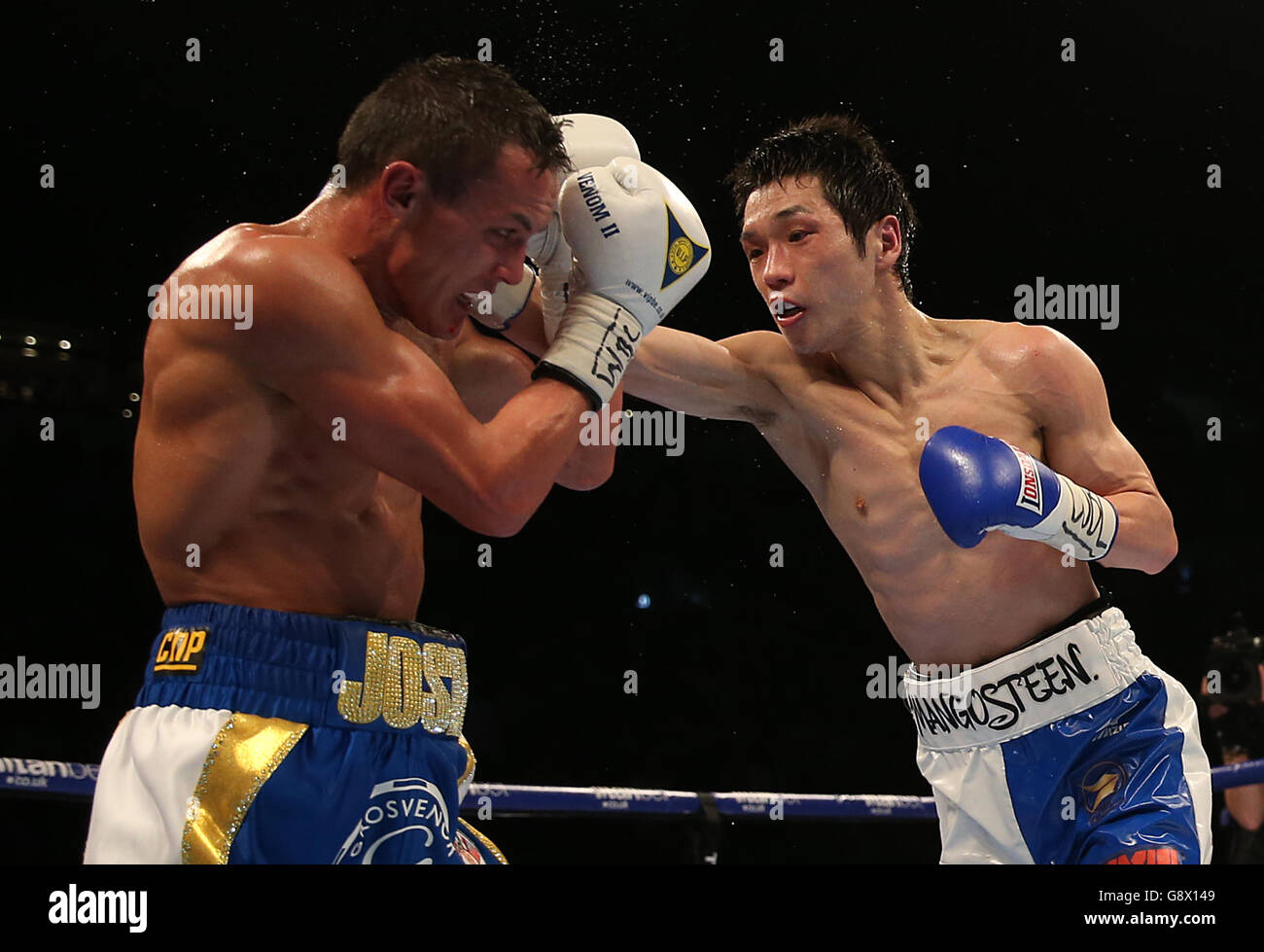 Josh Warrington (left) and Hisashi Amagasa during the WBC International Featherweight Championship bout at the First Direct Arena, Leeds. Stock Photo