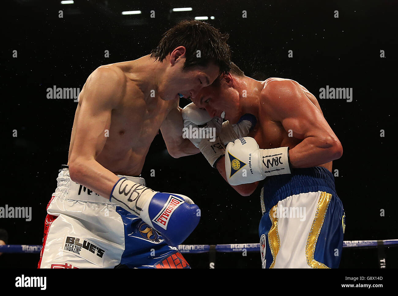 Josh Warrington (right) and Hisashi Amagasa during the WBC International Featherweight Championship bout at the First Direct Arena, Leeds. Stock Photo