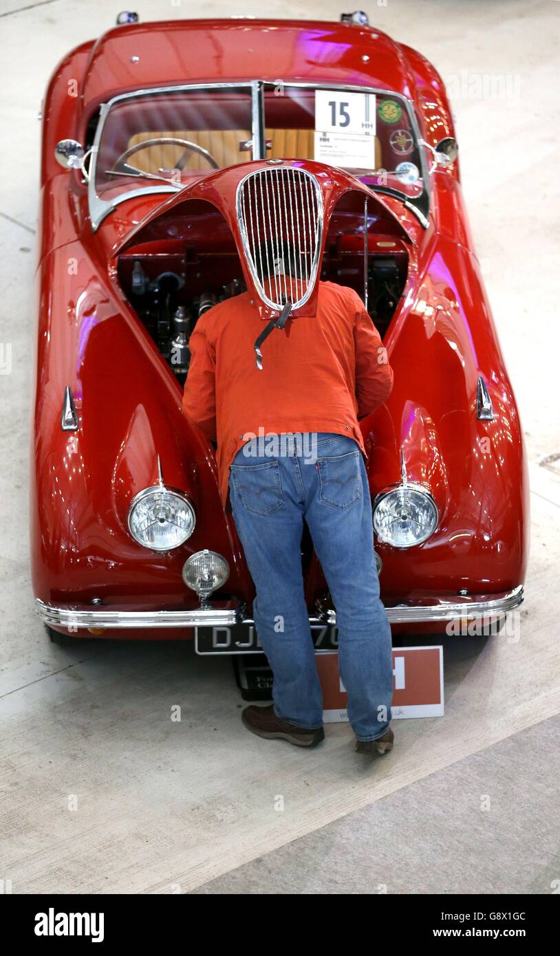 David Baily from Stoke on Trent looks underneath the of a Jaguar