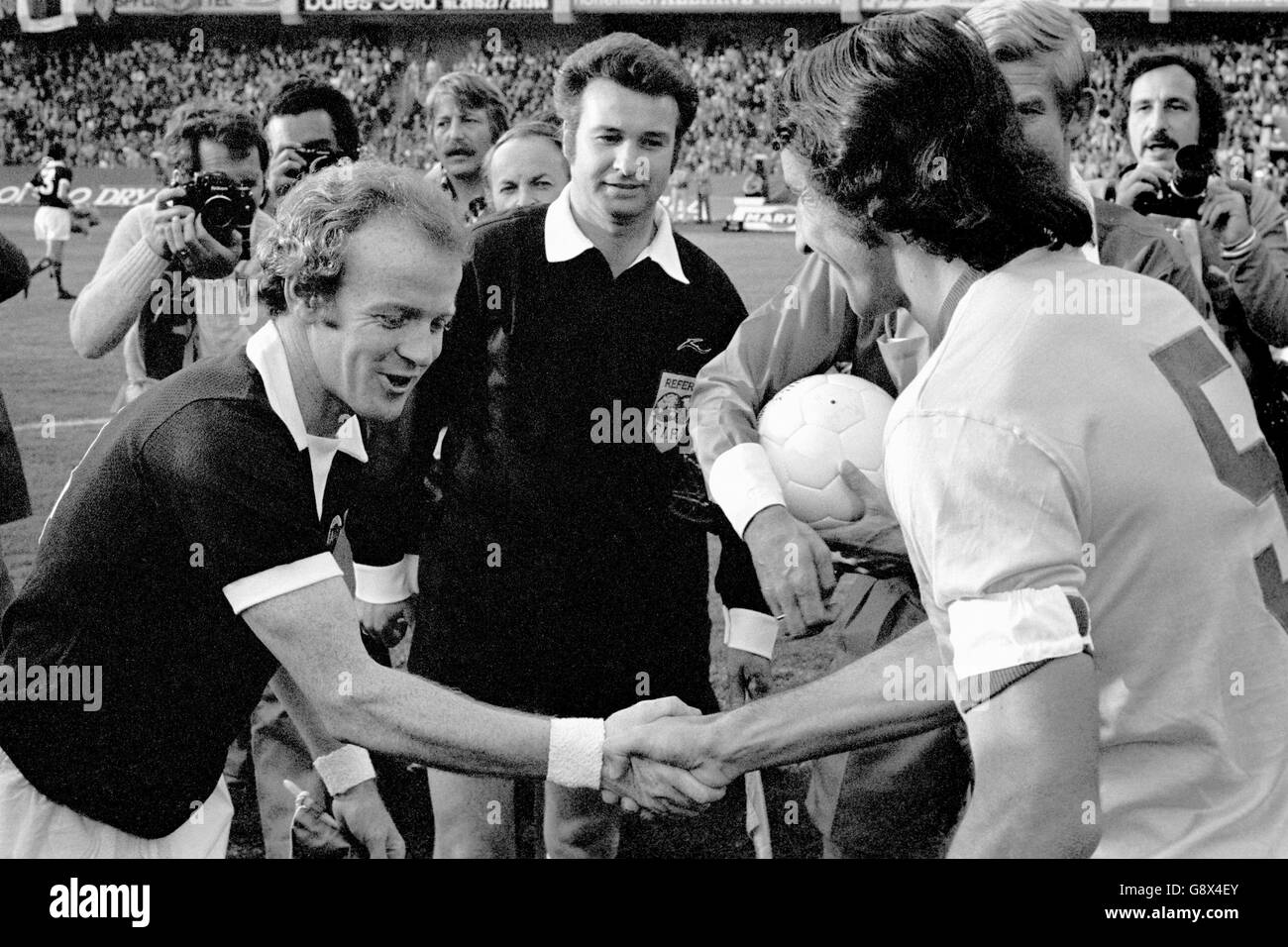 Soccer - World Cup West Germany 1974 - Group Two - Brazil v Scotland - Wald Stadium. The two captains, Scotland's Billy Bremner (l) and Brazil's Piazza (r), shake hands before the match Stock Photo