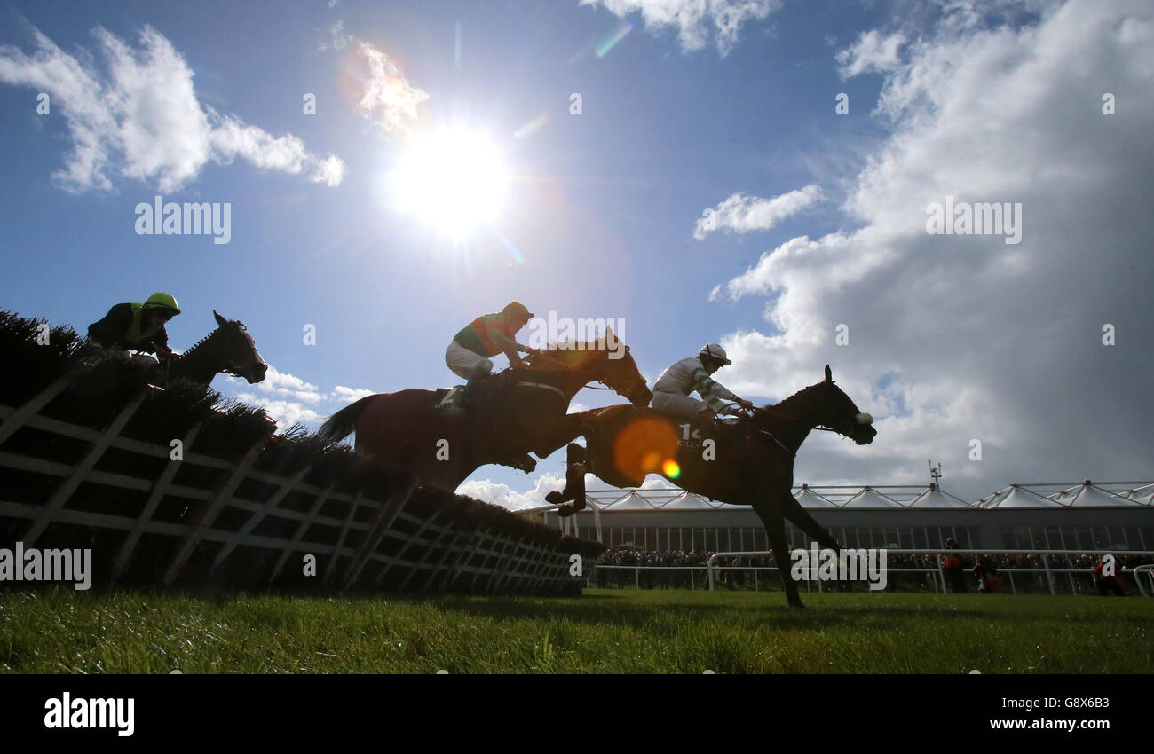 Tempo Mac ridden by Luke Dempsey (right) jumps the fence on his way to winning the Killashee Handicap Hurdle during day one of the Punchestown Festival at Punchestown, Co. Kildare, Ireland. Stock Photo