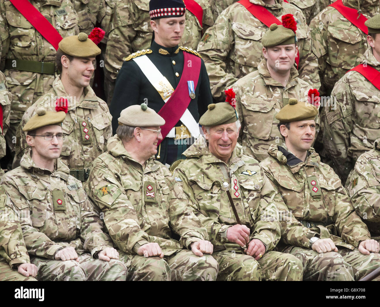 The Prince of Wales poses for a photo with members of the armed forces