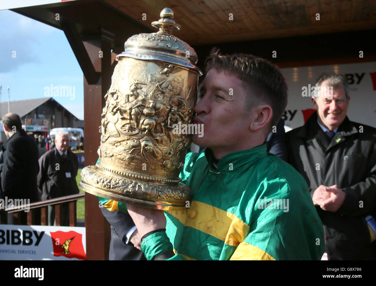 Jockey Barry Geraghty celebrates winning the Bibby Financial Services