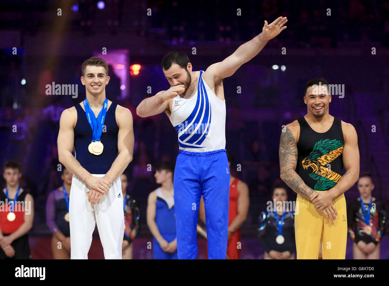 First placed Ashley Watson (centre) celebrates on the podium alongside