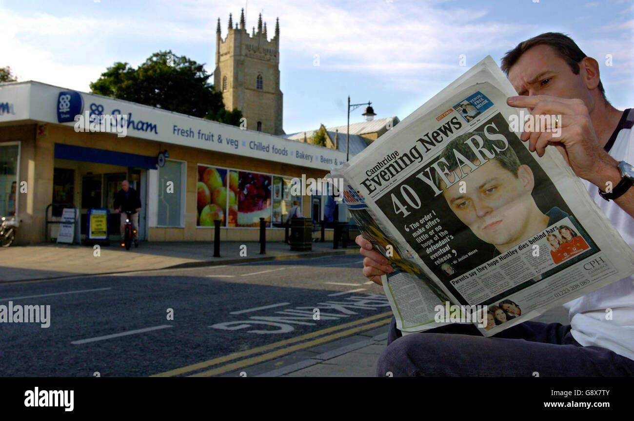 A man reads the Cambridge Evening News in Soham Village, Cambridgeshire, Thursday September 29, 2005, after it was announced that Soham murderer Ian Huntley will serve a minimum of 40 years for the murder of Jessica Chapman and Holly Wells. See PA story COURTS Soham. PRESS ASSOCIATION Photo. Photo credit should read: Chris Radburn/PA Stock Photo