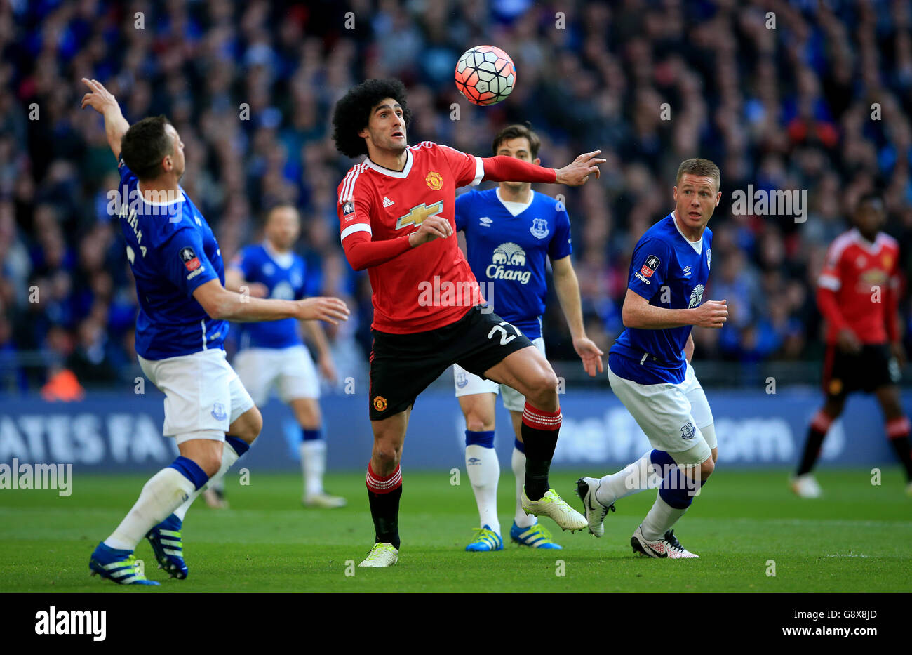 Manchester United's Marouane Fellaini (centre) in action during the Emirates FA Cup, Semi-Final match at Wembley Stadium, London. Stock Photo