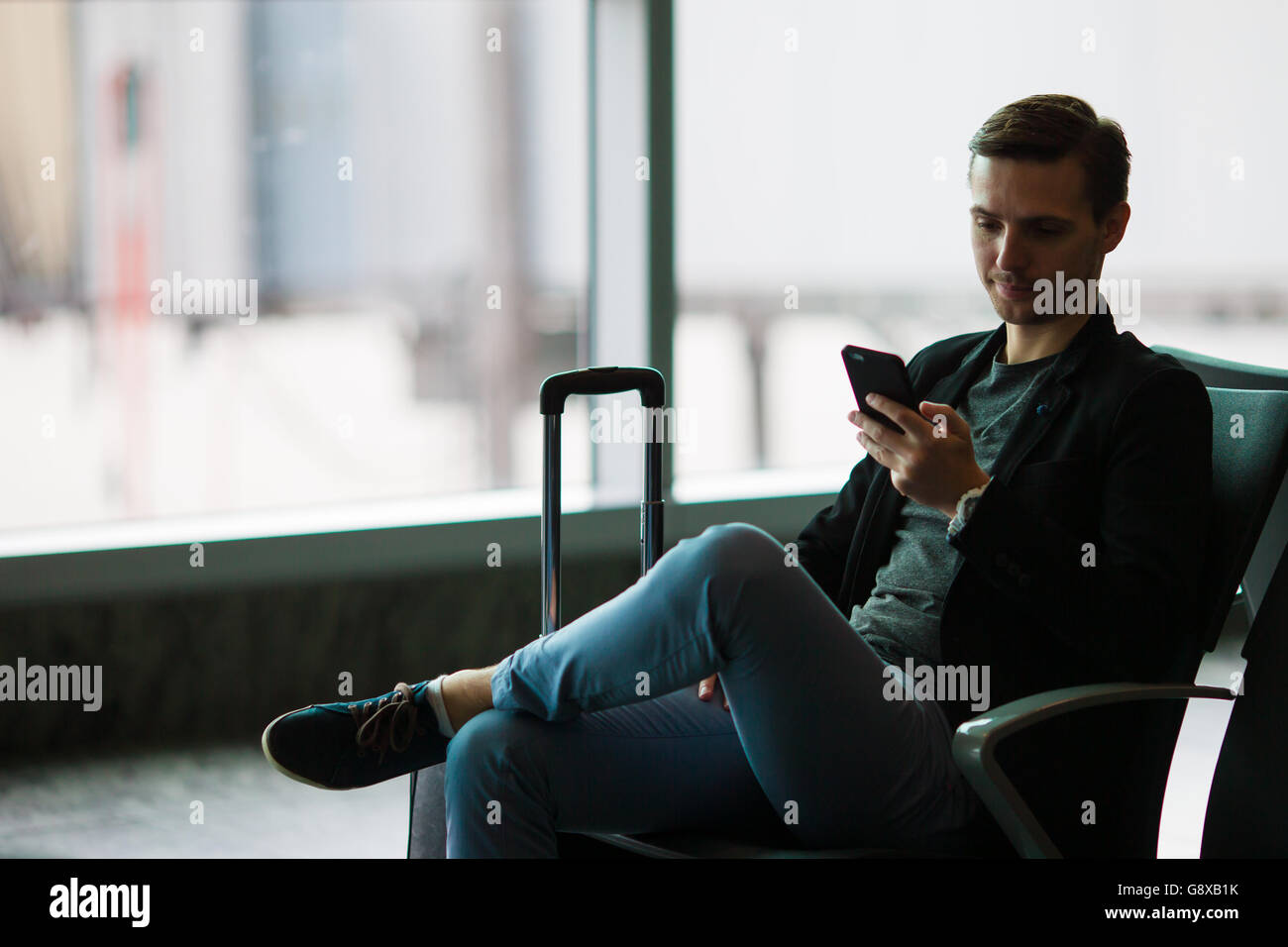 airport. Casual young businessman 