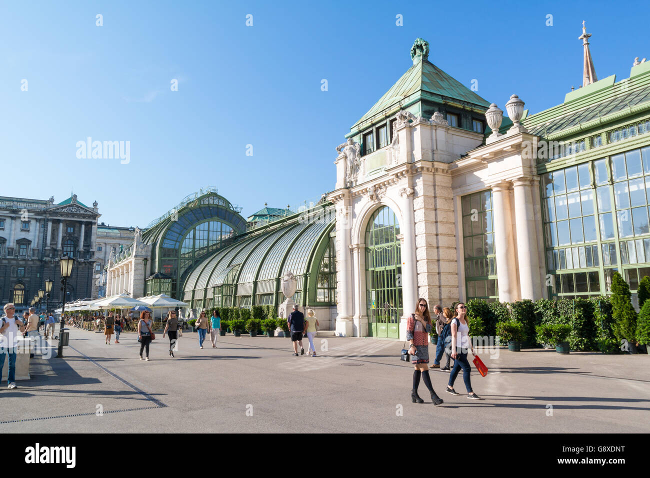 People walking in front of Palm House in Burggarten gardens in downtown Vienna, Austria Stock Photo