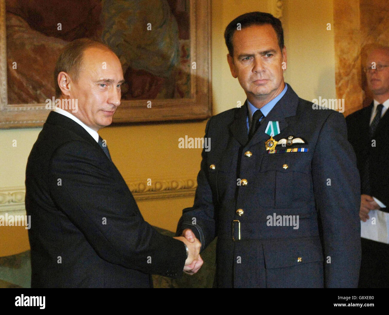 Squadron Leader Keith Hewitt receives the 'Order of Friendship' from Russian President Vladimir Putin at Downing Street, Wednesday October 5, 2005, for his part in freeing the Russian submersible, AS28 Priz in August. See PA Story DEFENCE Putin. PRESS ASSOCIATION Photo. Photo credit should read: Stefan Rousseau/PA/WPA Rota Stock Photo