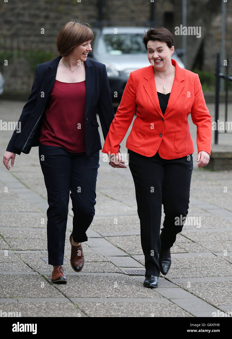 Scottish Conservative leader Ruth Davidson arrives with partner Jen Wilson to cast her vote at Cafe Camino, St Mary's Parish Centre in Edinburgh for the Scottish parliamentary elections on polling day. Stock Photo