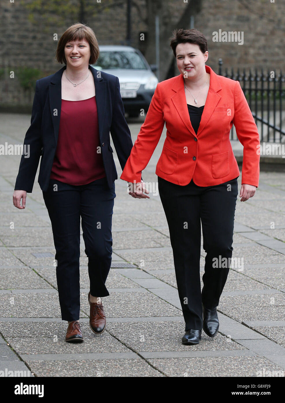 Scottish Conservative leader Ruth Davidson arrives with partner Jen Wilson to cast her vote at Cafe Camino, St Mary's Parish Centre in Edinburgh for the Scottish parliamentary elections on polling day. Stock Photo