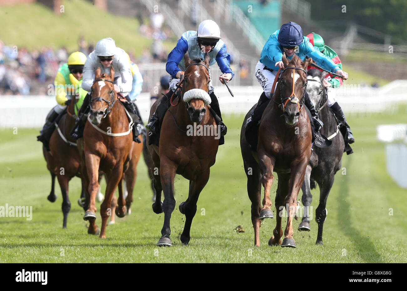 Ian Flemming (centre) ridden by Edward Greatrex wins The Boodles Diamond Handicap Stakes from Above N Beyond (right), during Boodles Ladies Day of the Boodles May Festival at Chester Racecourse. Stock Photo