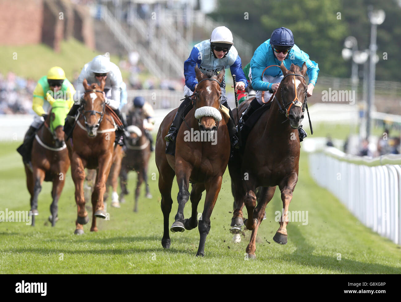 Ian Flemming (centre) ridden by Edward Greatrex wins The Boodles Diamond Handicap Stakes from Above N Beyond (right), during Boodles Ladies Day of the Boodles May Festival at Chester Racecourse. Stock Photo