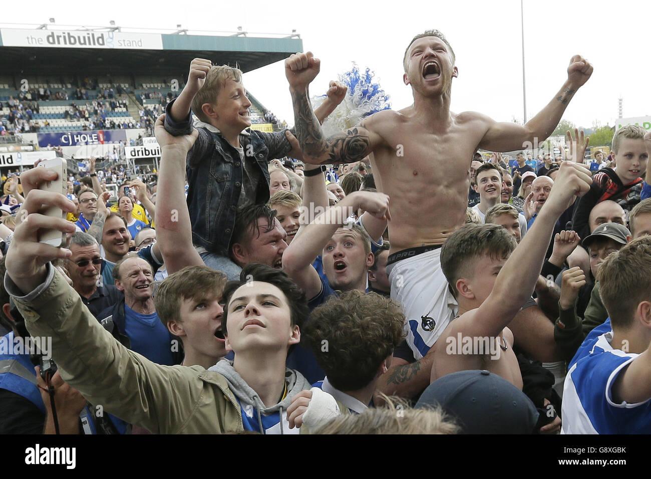 Bristol Rovers Matt Taylor celebrates on the pitch after securing