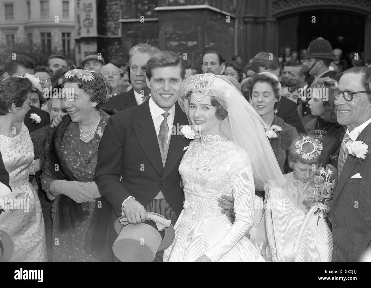 Singer Ronnie Carroll with his bride Millicent Martin, 25, star of The Crooked Mile at the Cambridge Theatre, after their wedding at Holy Trinity Church in Paddington. Stock Photo