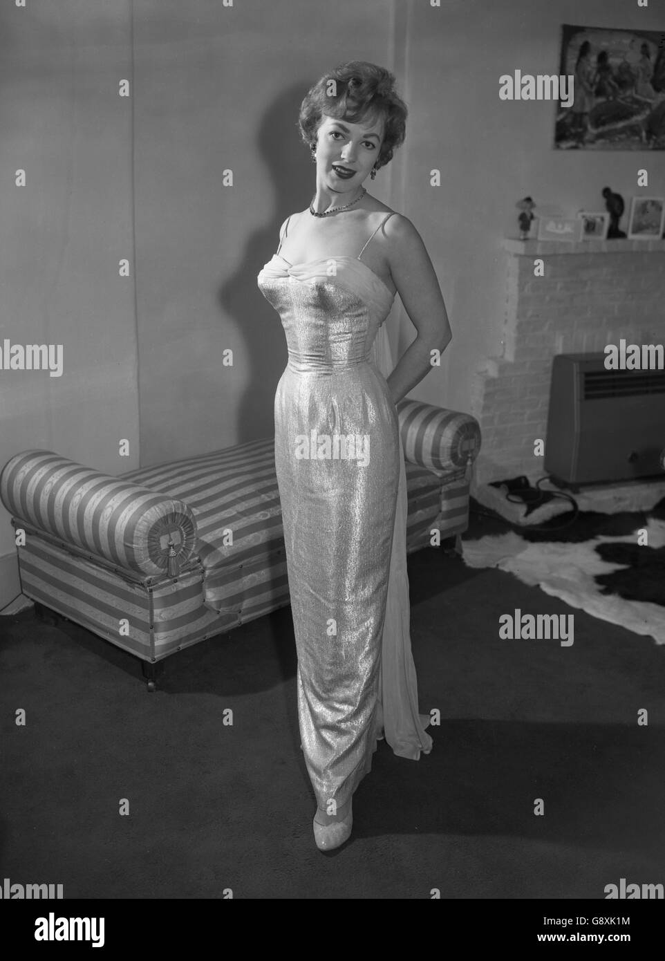 Gleaming evening gown of real gold thread is worn by Hull-born actress, singer and dancer Patricia Bredin. Stock Photo