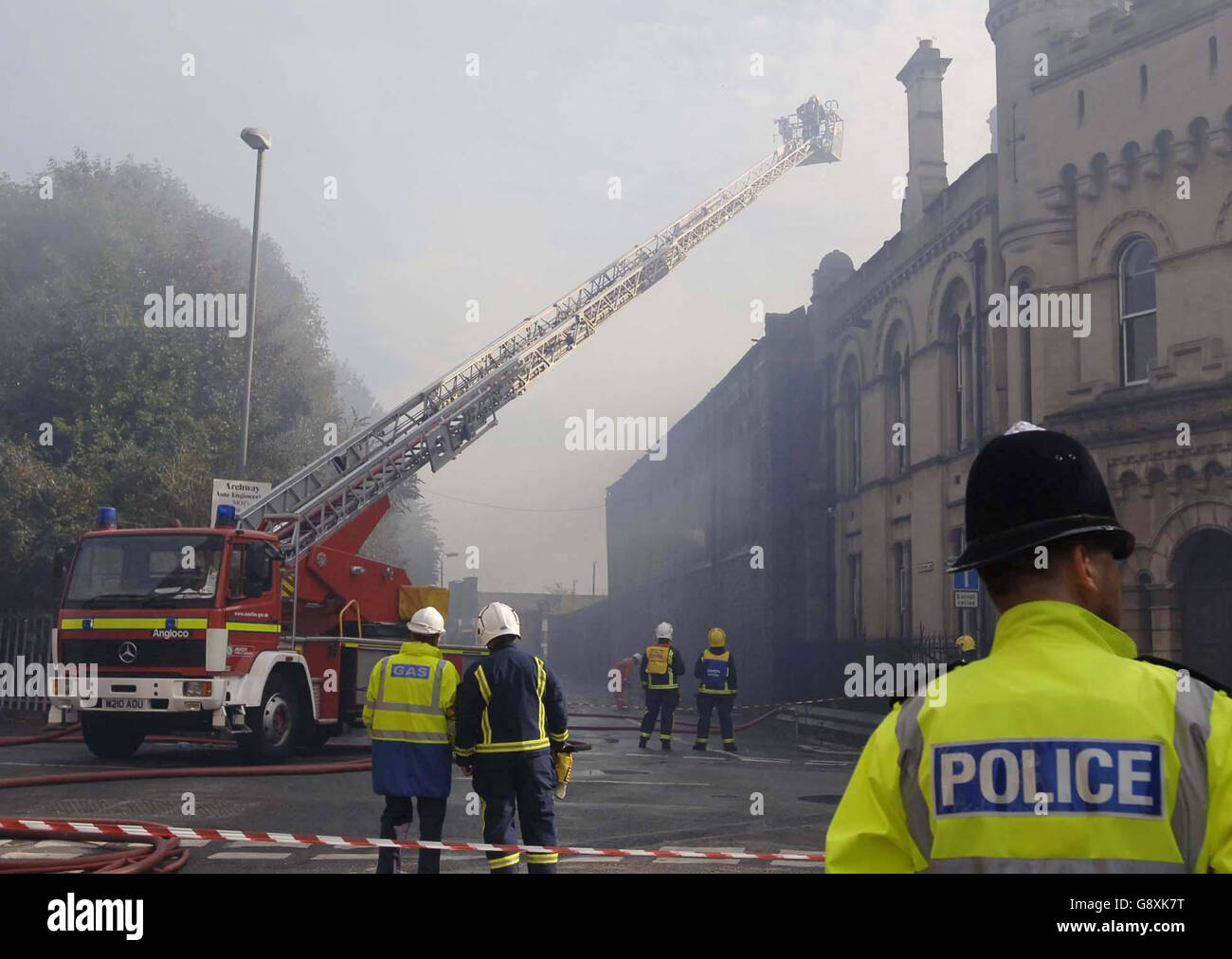 Firemen damping down a warehouse belonging to Aardman Animations in Bristol following a fire. Stock Photo