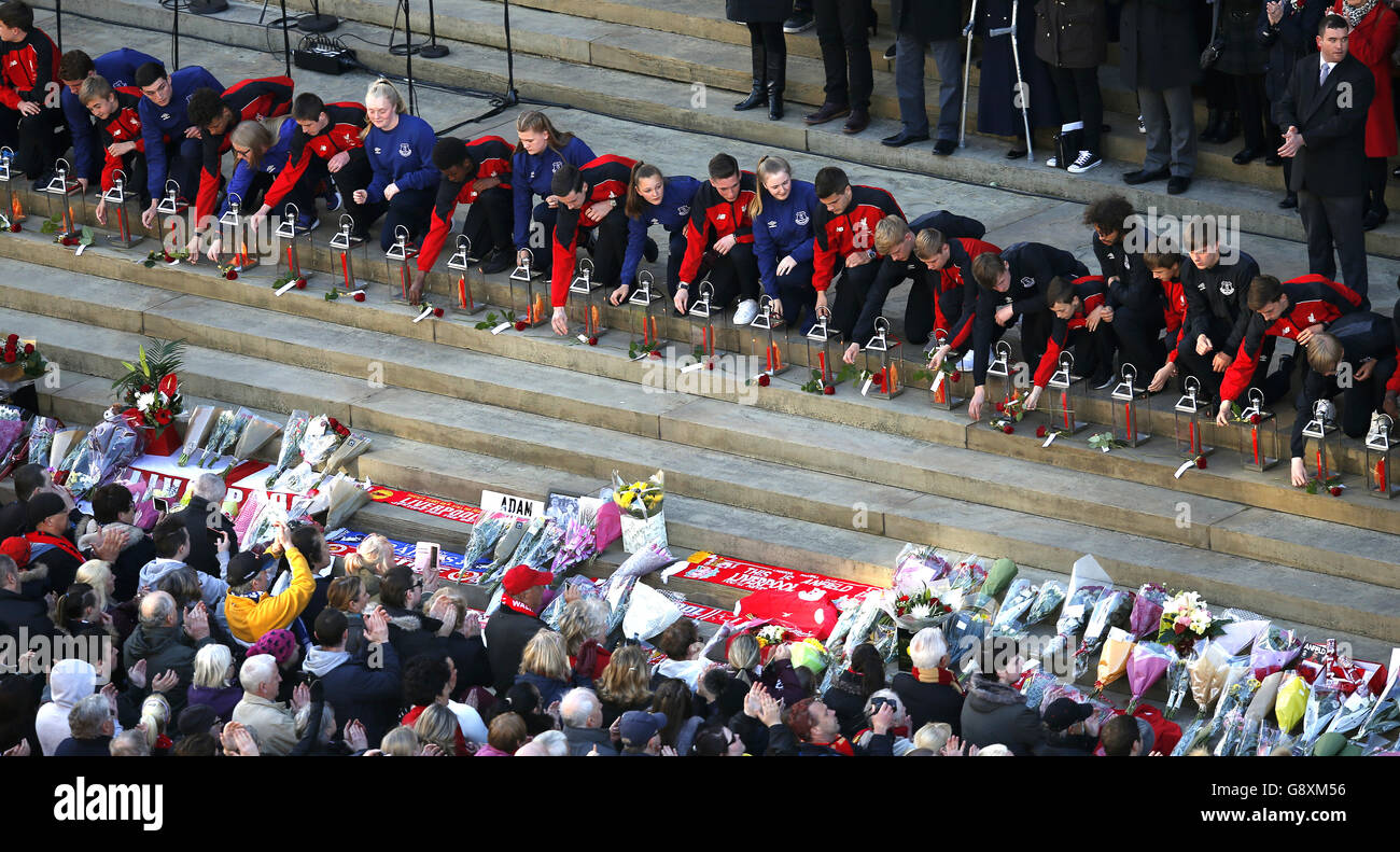 Representatives (96 in total) of Liverpool Football Club and Everton Football Club lay roses at a commemorative event at St George's Hall in Liverpool, to mark the outcome of the Hillsborough inquest which ruled that 96 Liverpool fans who died as a result of the Hillsborough disaster were unlawfully killed. Stock Photo