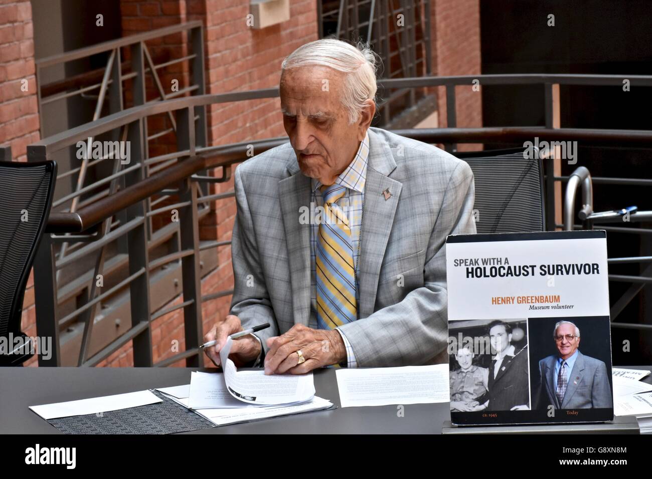 A survivor from the holocaust in Germany signing autographs and handing out his book at the holocaust museum in DC Stock Photo