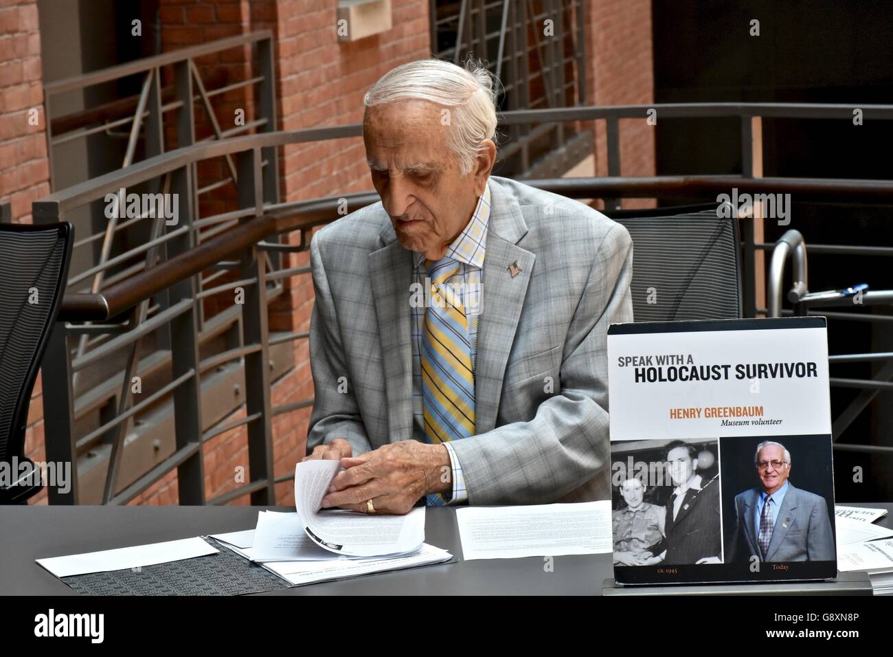 A survivor from the holocaust in Germany signing autographs and handing out his book at the holocaust museum in DC Stock Photo