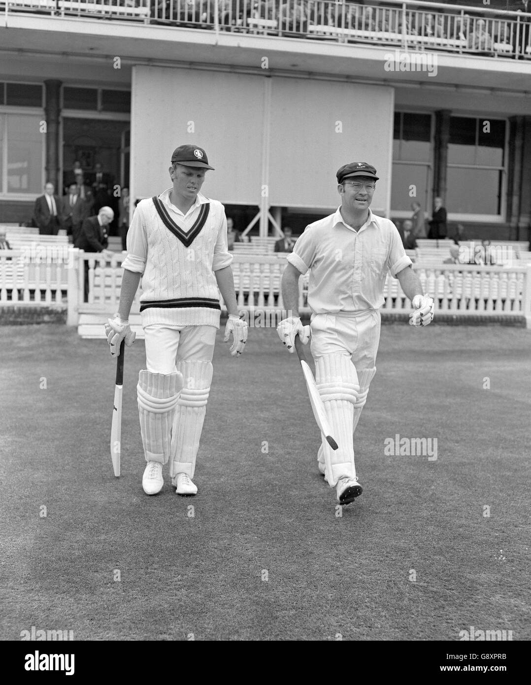 Barry Richards (l) and Eddie Barlow (r) make their to the crease to start batting for the Rest of the World XI side Stock Photo