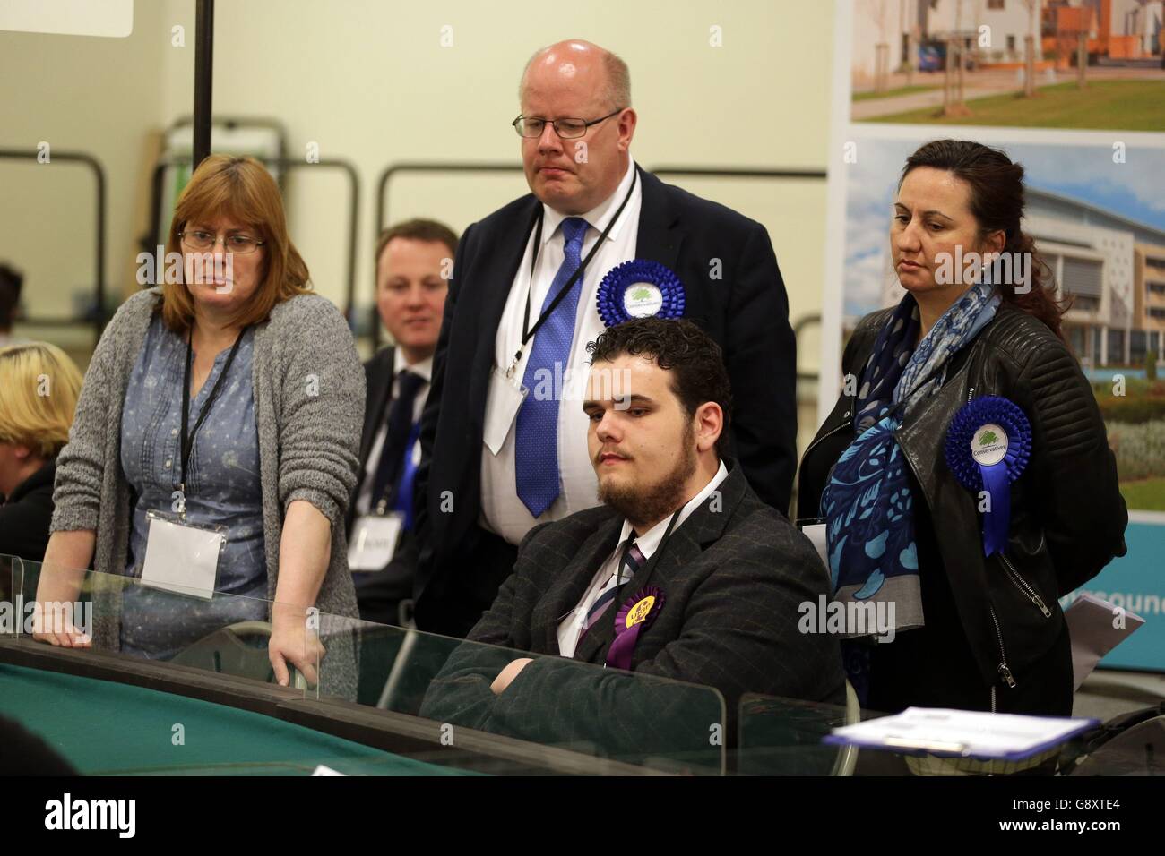 Candidates waiting in front of volunteers sorting ballot papers as they arrive at the Latton Bush Centre, Southern Way, Harlow, Essex, as counting begins across the UK in local council elections. Stock Photo