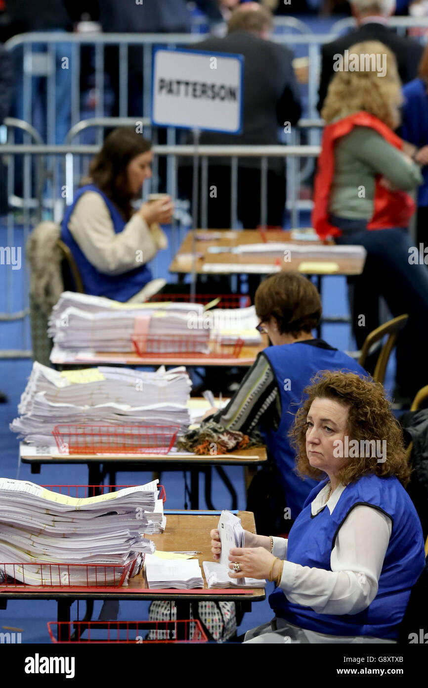 Volunteers count ballot papers at the counting centre at the Titanic Exhibition Centre, Belfast, after elections to decide the make-up of the next Stormont Assembly. Stock Photo