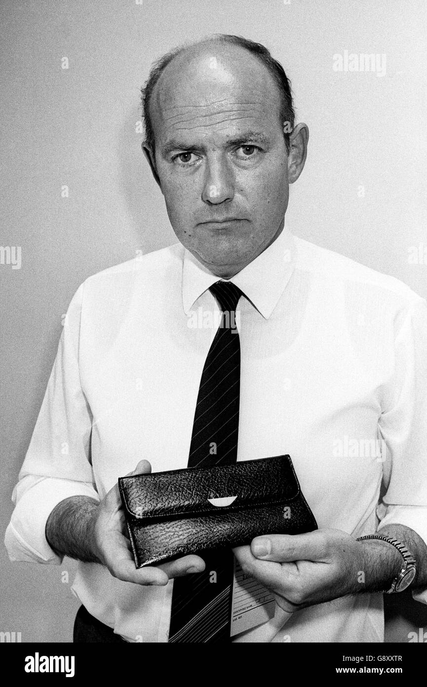 Detective Superintendent Tim Hurford investigating the murder of Bath schoolgirl Melanie Road. He is holding a black purse similar to that of murdered schoolgirl Melanie Road, whose body was found in the Lansdown area after she was sexually assaulted and stabbed after a night out with friends in Bath. Stock Photo