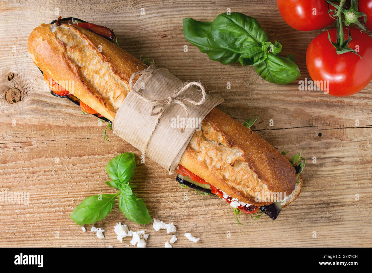 Papered vegetarian baguette submarine sandwich with grilled eggplant